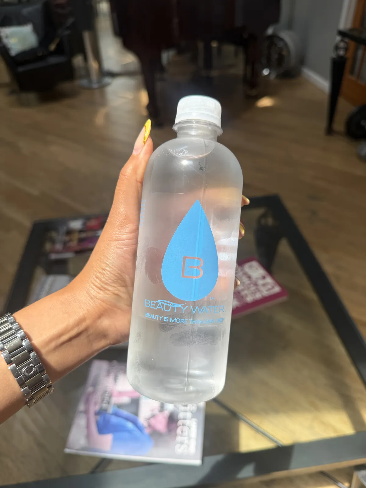 A Beauty Water customer with their bottle