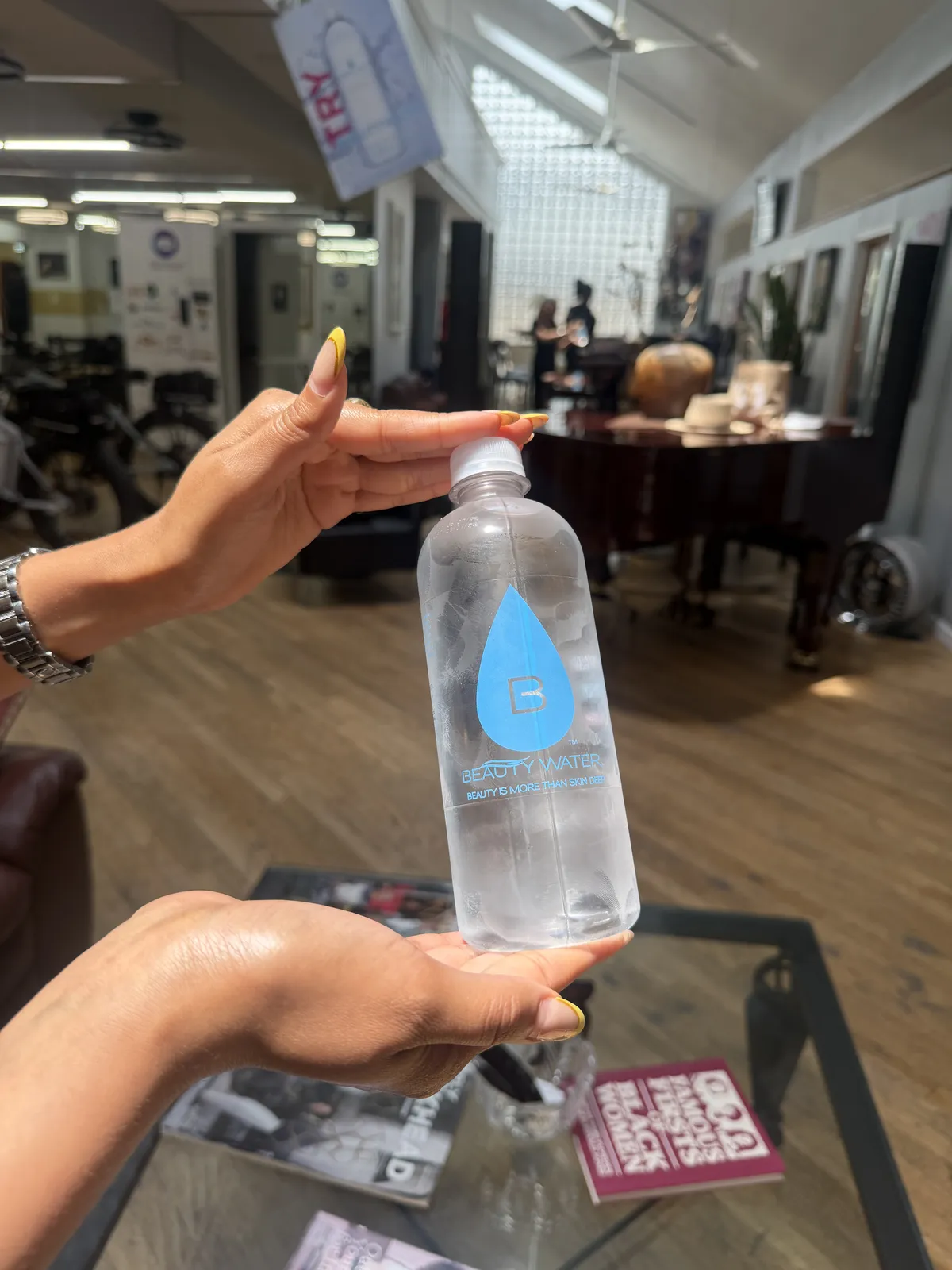 A Beauty Water customer with their bottle