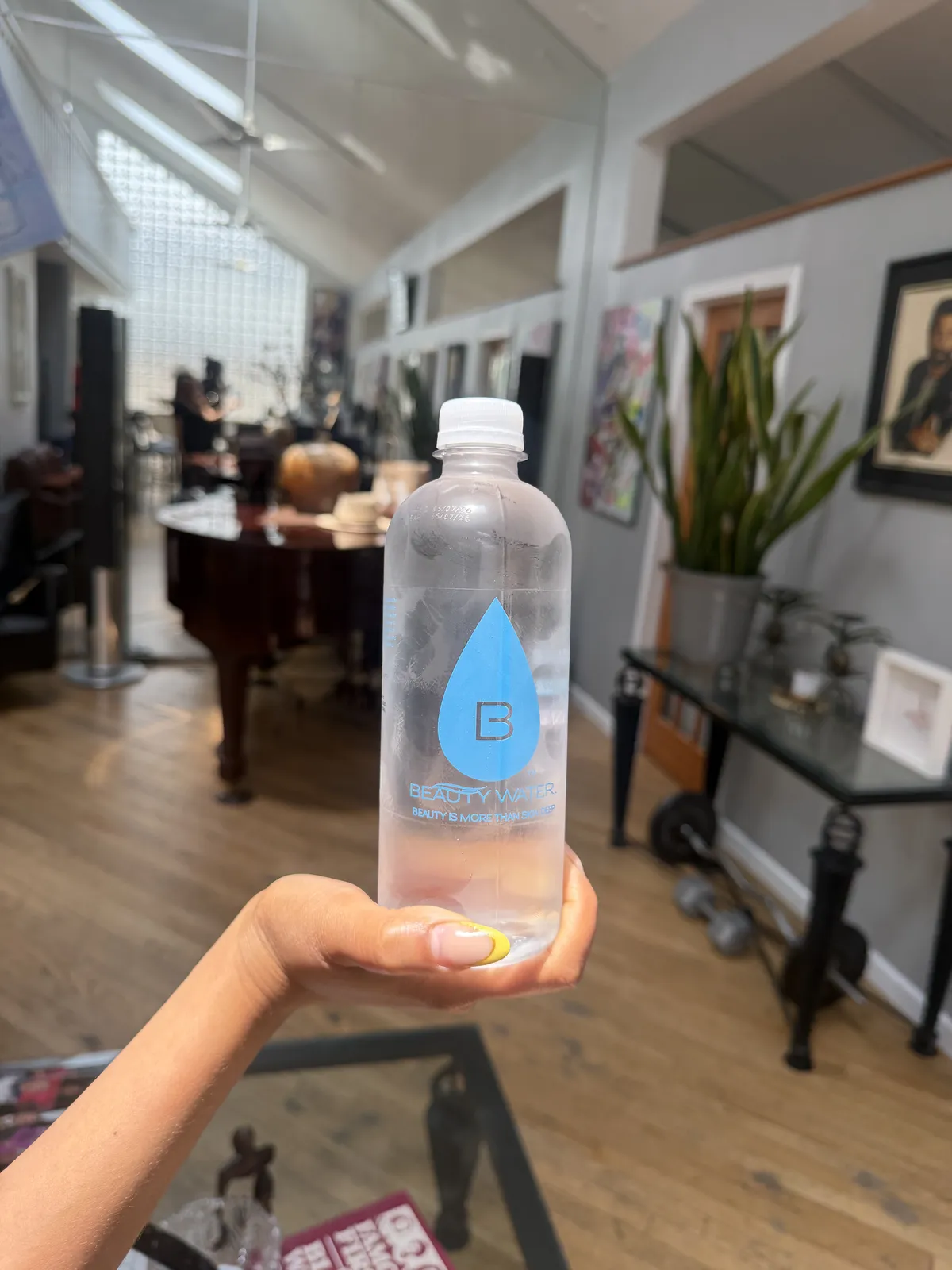 A Beauty Water customer with their bottle