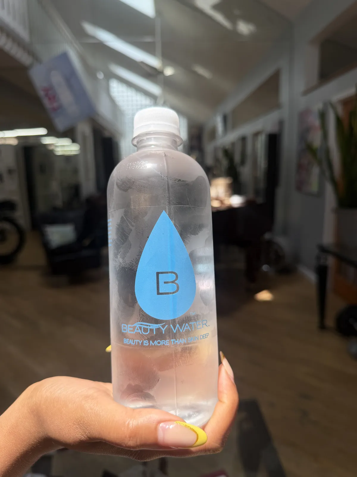 A Beauty Water customer with their bottle